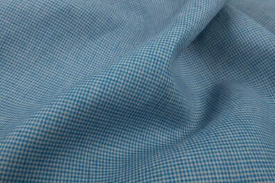 Tissu 100% lin à carreaux vichy gris et bleu.
