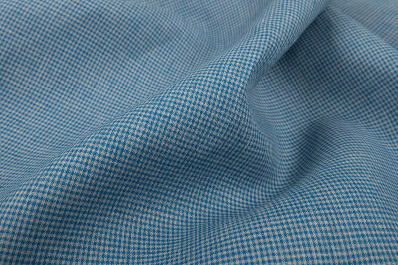 Tissu 100% lin à carreaux vichy gris et bleu.