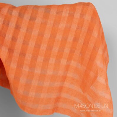 Tissu orange en lin à carreaux ajouré.
