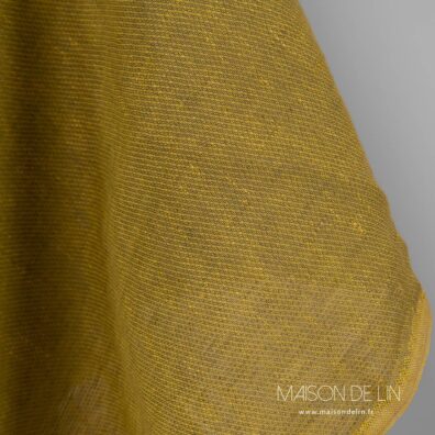 Tissu lin ocre mélange des couleurs jaune et vert.