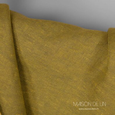 Tissu lin ocre mélange des couleurs jaune et vert.