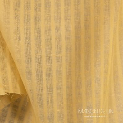 Lin jaune tissu en rayures ajourés verticales.
